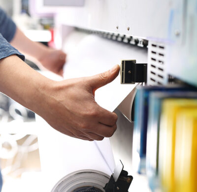 a person operating a commercial printer