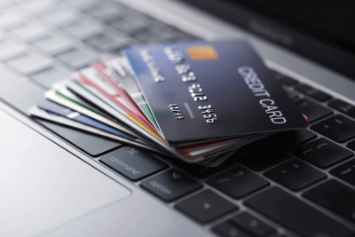 Credit cards sitting on a keyboard.